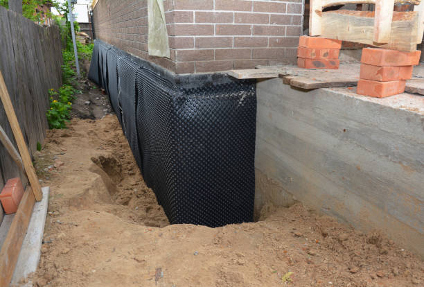 Happy homeowners after waterproofing job in Minor Hill